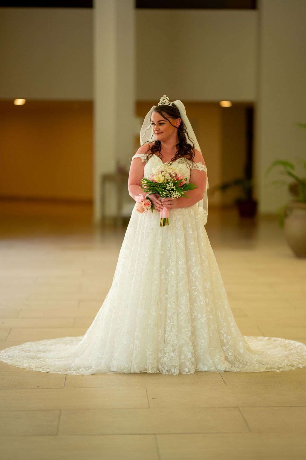 Bride walking down grand staircase